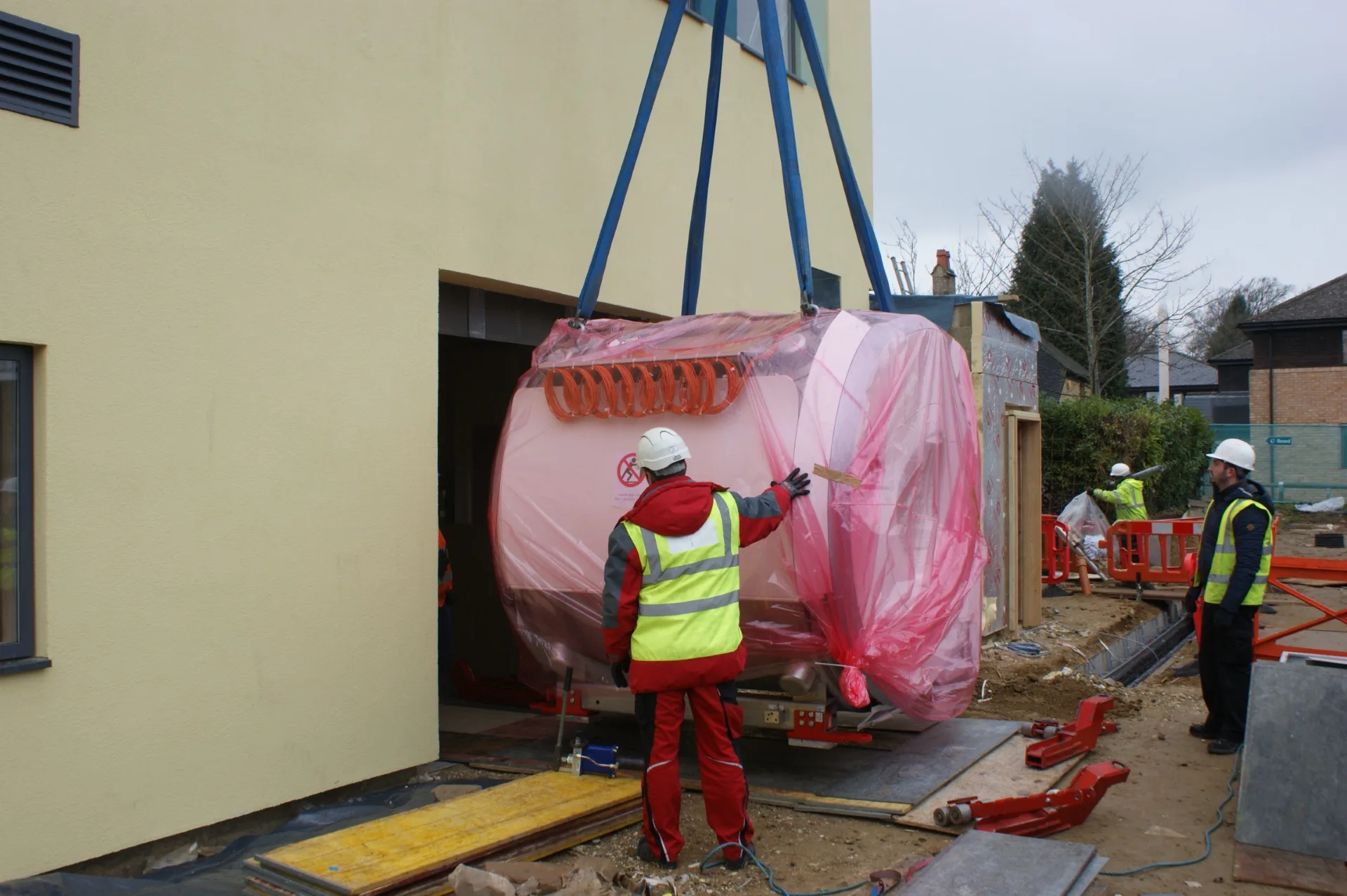 This series of photographs shows the neuroimaging magnet being installed at the Oxford Centre for Brain Activity in 2016. Credit: Oxford University’s Department of Psychiatry