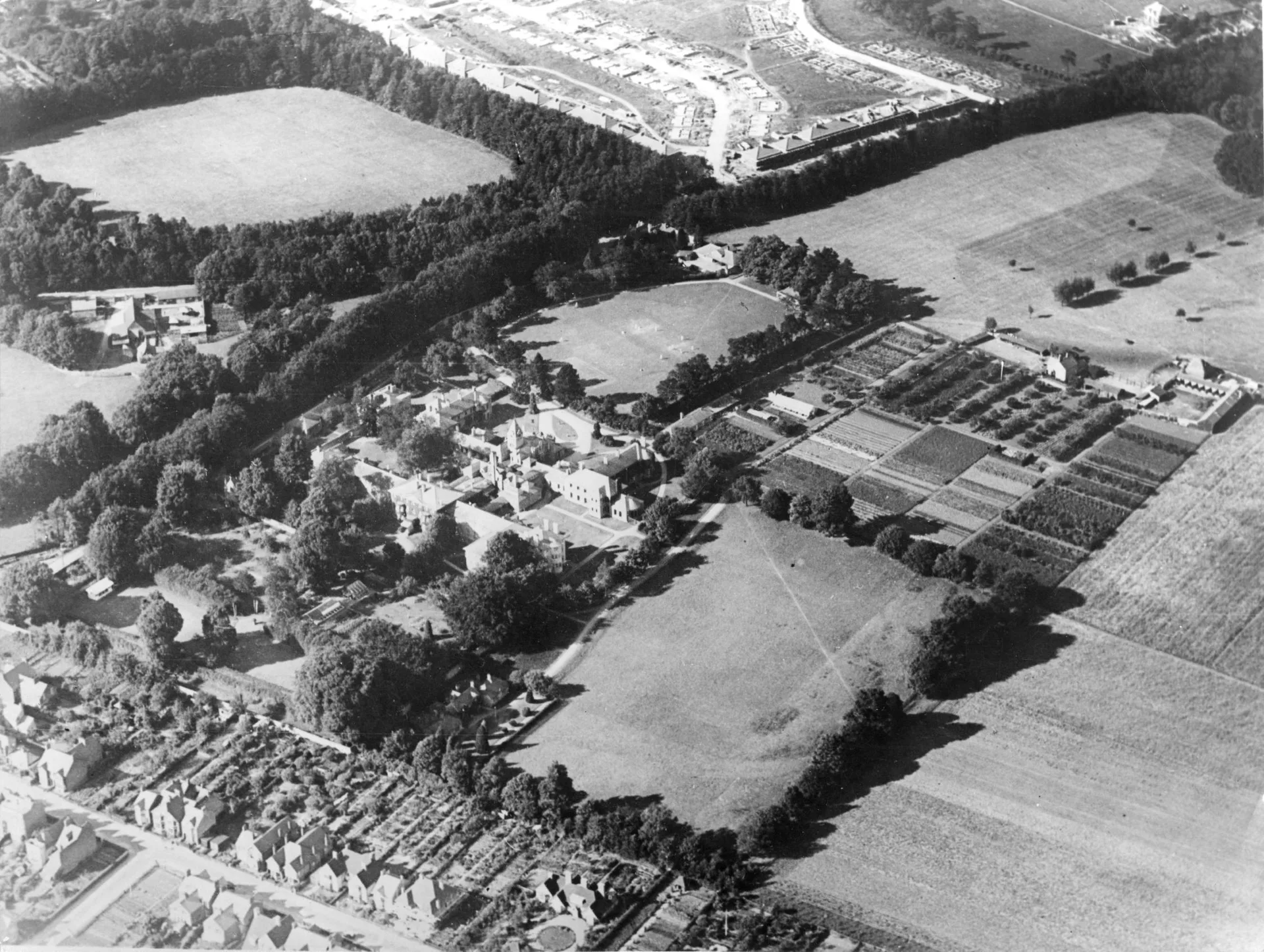 An aerial photograph of the Warneford Estate in 1929 showing the farmhouse and cultivated fields (top right). Credit: Oxfordshire History Centre POX0123024
