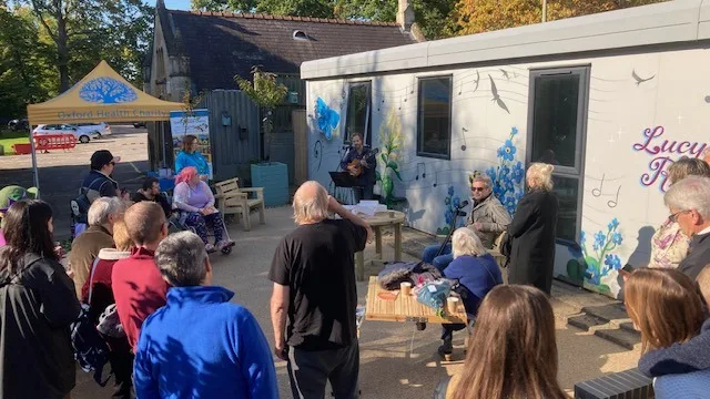 A music therapy session taking place outside Lucy’s Room. Credit: Tom Cox